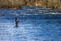 Fly Fisherman Casting an Artificial Fly for a Trout in Roanoke River, Virginia, USA Royalty Free Stock Photo